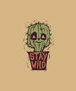 Cute and weird eyed cactus growing in pot with motivational phrase Stay Wild written on it. Cartoon character with