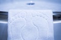 Cute white bathmat with footprints