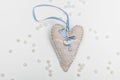 Cute white-blue heart with a stone and lace on a white background for a card Royalty Free Stock Photo