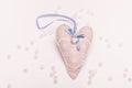 Cute white-blue heart with stone and lace close-up on a pink background for a card Royalty Free Stock Photo