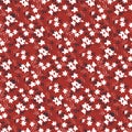 Cute white ditsy flowers on red seamless pattern
