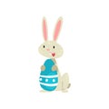 Cute White Easter Bunny with Blue Colored Egg, Adorable Rabbit Cartoon Character Vector Illustration Royalty Free Stock Photo