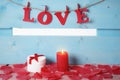 Gift box and the word love in candlelight Royalty Free Stock Photo