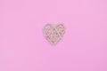 cute White heart on a pink background place for text. Wooden alone symbol of love for the holiday valentine's and mother
