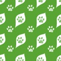 Cute white leaves and doodle paw prints with green background. Fabric design seamless nature pattern Royalty Free Stock Photo