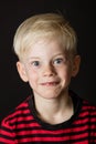 Cute wide eyed little blond boy Royalty Free Stock Photo