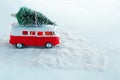 christmas tree on retro toy truck in snowy forest