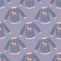 Cute winter seamless pattern with christmas sweater with deer. Blue palette artwork