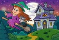 Cute witch on broom near haunted house