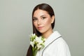 Cute woman after bath white gentle flowers on white background