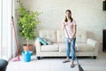 Cute woman cleaning her house Royalty Free Stock Photo