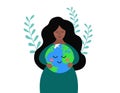 Cute woman embraces happy Earth planet with care and love. Girl holding Earth. Environment conservation and saving planet concept Royalty Free Stock Photo