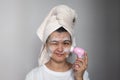 Cute woman facial remove makeup with special brush for deep cleansing. Skin Care face concept. Spa home Royalty Free Stock Photo