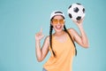 Cute woman fan of football championship. Fit girl holding ball Royalty Free Stock Photo