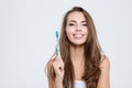 Cute woman holding toothbrush