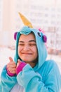 Cute woman in kigurumi unicorn costume Royalty Free Stock Photo