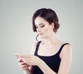 Cute woman phone. Girl with smartphone texting Royalty Free Stock Photo