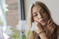 Cute woman portrait. Blonde girl with long curly hair and makeup Royalty Free Stock Photo