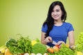 Cute woman preparing organic vegetables