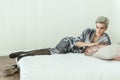Cute woman resting lying on the bed at home Royalty Free Stock Photo