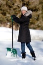 Cute Woman shoveling snow Royalty Free Stock Photo