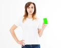 Cute woman with smartphone standing on white background. Happy beautiful young girl with long hair holding blank screen mobile Royalty Free Stock Photo