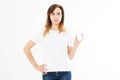 Cute woman with smartphone standing on white background. Happy beautiful young girl with long hair holding blank screen mobile Royalty Free Stock Photo