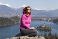 Cute woman sunbathing by the Lake Bled