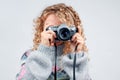 Cute woman taking a photo with a camera on a white background Royalty Free Stock Photo