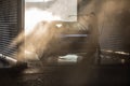 Cute woman washing her car in a manual carwash Royalty Free Stock Photo