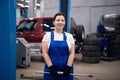 A female worker holding wrench and smiling Royalty Free Stock Photo