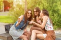 3 cute women, ice cream parlors, while laughing Royalty Free Stock Photo