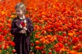 Cute wonderful kid child girl walks in a flowering spring meadow Royalty Free Stock Photo