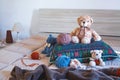 Cute wool teddy bear is lying in the bed Royalty Free Stock Photo