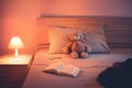 Cute wool teddy bear is lying in the bed Royalty Free Stock Photo