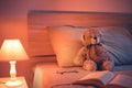 Cute wool teddy bear is lying in the bed Royalty Free Stock Photo