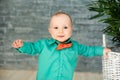 cute 1 year old boy stands. Child with happy expression. sweet baby boy, closeup portrait of child, cute toddler with grey eyes.