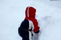 Cute year-old girl playing in the snow