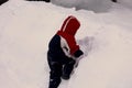 Cute year-old girl playing in the snow