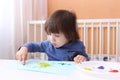 Cute 2 years boy with finger paints Royalty Free Stock Photo