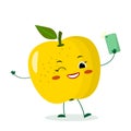 Cute yellow apple cartoon character with a smartphone and does selfie.