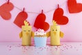 Cute yellow handmade paper birds and red hearts on a string Royalty Free Stock Photo