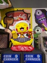 A cute yellow japanese lucky cat doll in a toy store