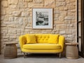 Cute yellow loveseat sofa and round stone side table against of stucco wall with poster frame Interior design