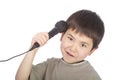 Cute young asian boy with microphone Royalty Free Stock Photo