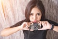 Cute young asian woman with retro camera with light. Hipster fashion photographer girl. Young people vintage tone. Life style and Royalty Free Stock Photo