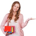 Cute young attractive student girl holding colorful exercise books. Royalty Free Stock Photo