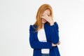 Cute, young beautiful red hair woman do facepalm. Redhead girl headache failed to upset business face palm. Portrait of female