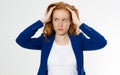 Cute, young beautiful red hair woman do facepalm. Redhead suffer girl headache failed to upset business face palm. Portrait of