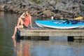 Cute young blonde woman - kayaking at lake Royalty Free Stock Photo